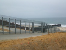 US -  Mexico border runs into the Pacific Ocean.