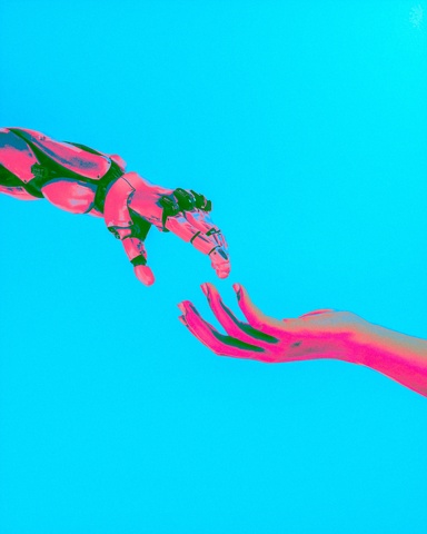 robot hand touching human hand