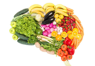 Vegetables and fruits laid out in shape of brain