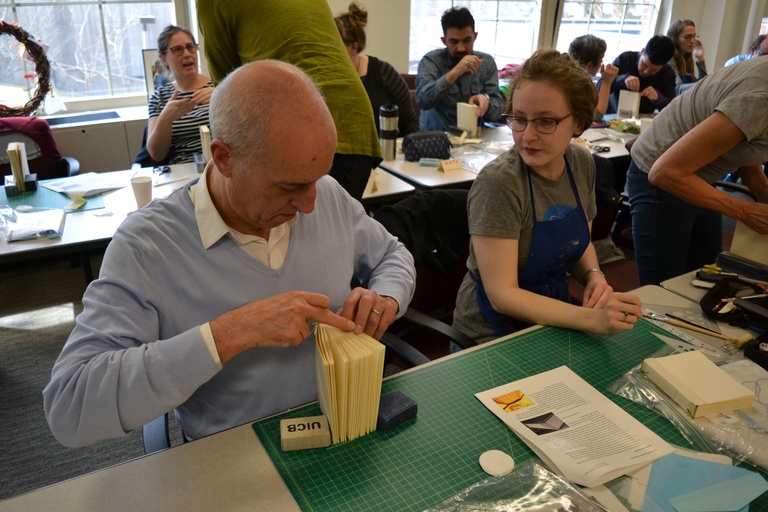 Students binding a handmade book