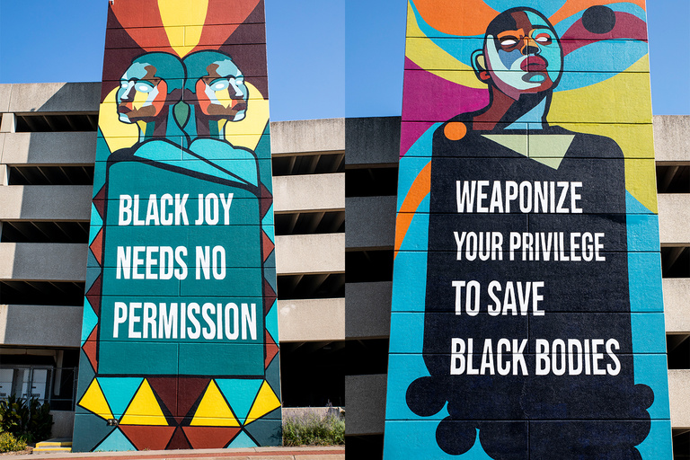 Two murals on the side of a parking garage with bright colors and African American faces. 