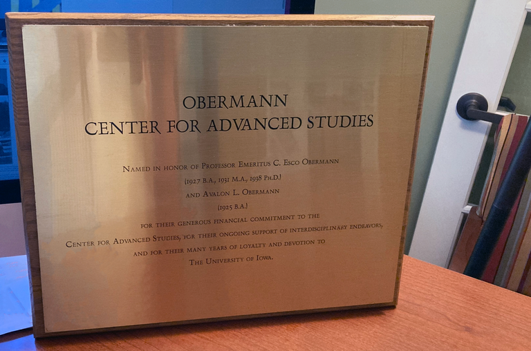Golden plaque that says "Obermann Center for Advanced Studies"