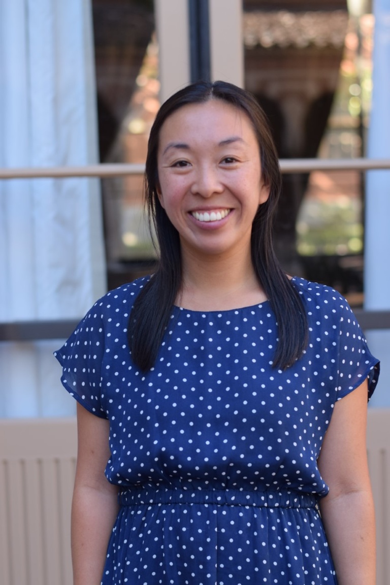 Head shot of smiling young Asian woman