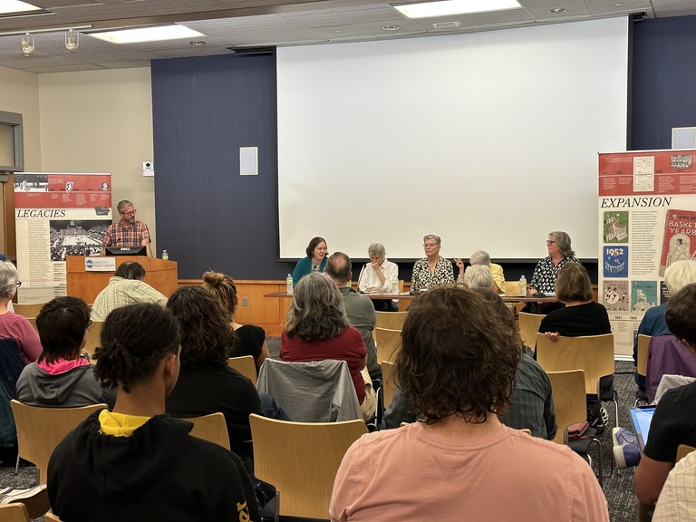 panelists at table in front of audience at ICPL