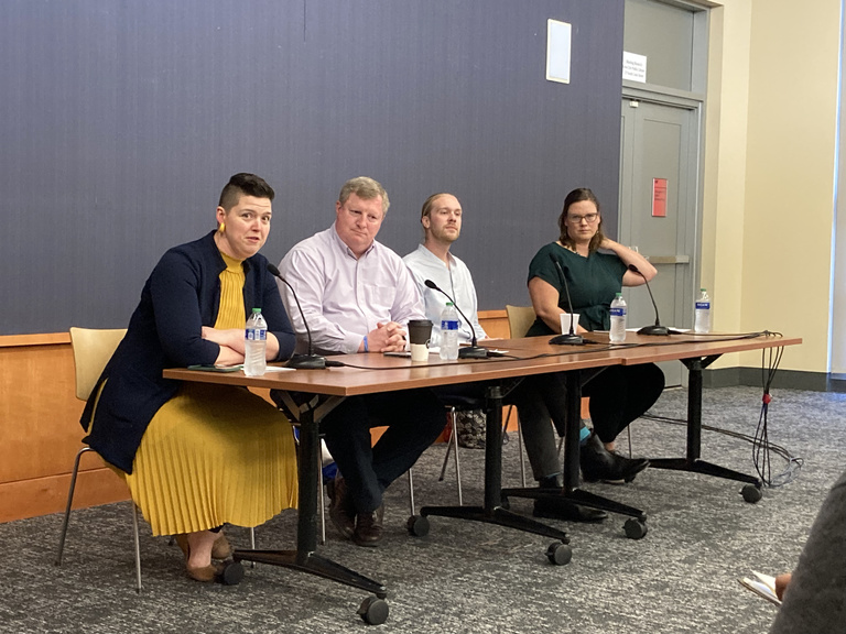 panelists at table in front of audience at ICPL