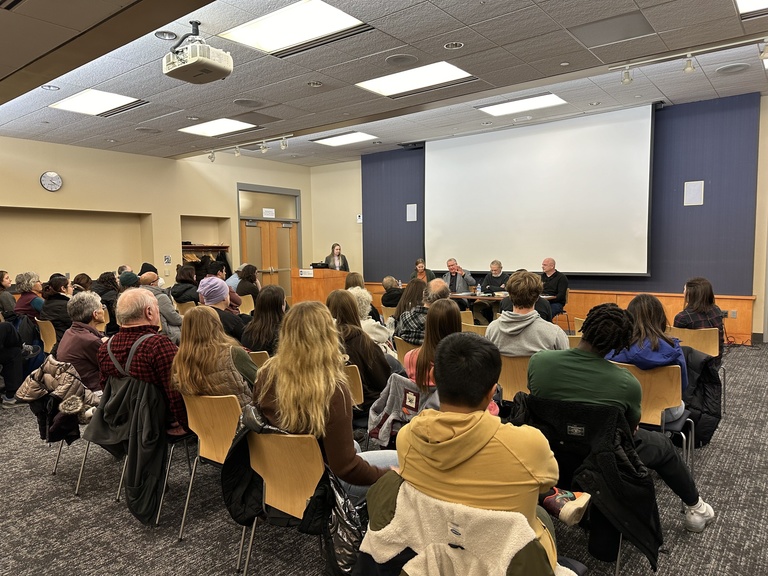 panelists at table in front of audience at ICPL