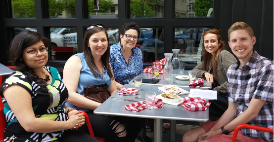 Bern-Klug and student researchers at outdoor cafe