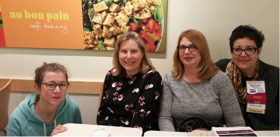 Bern-Klug and colleagues at a conference