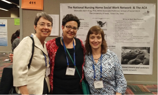 Bern-Klug and colleagues at a conference