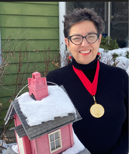 Bern-Klug wearing American Association of Social Work and Social Welfare medal