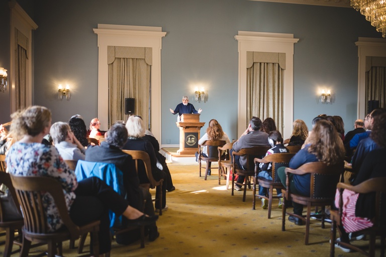 audience listening to speaker