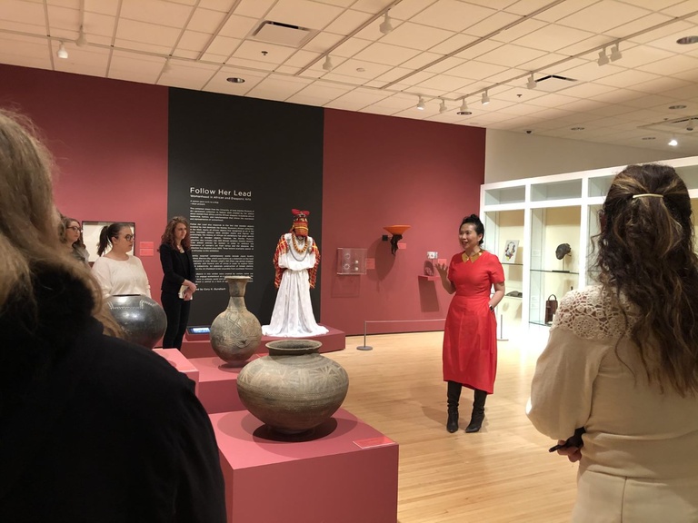 person presenting at art exhibit