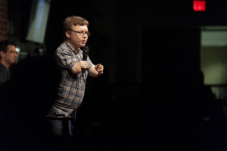 comic performing onstage