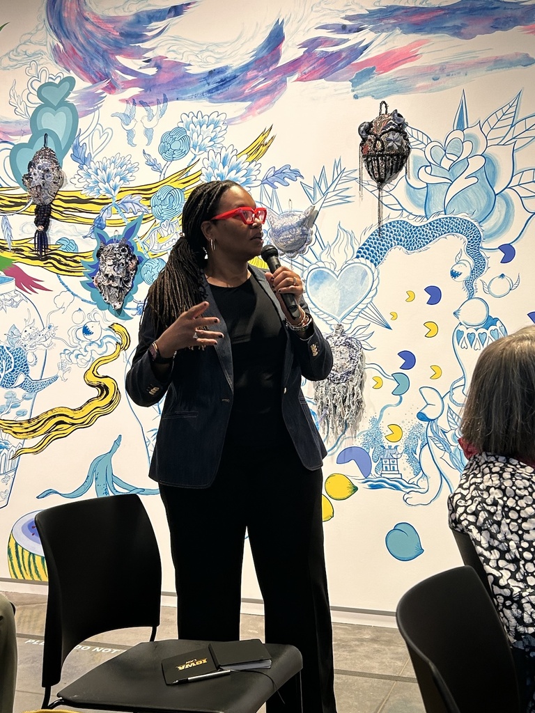 woman speaking at symposium event