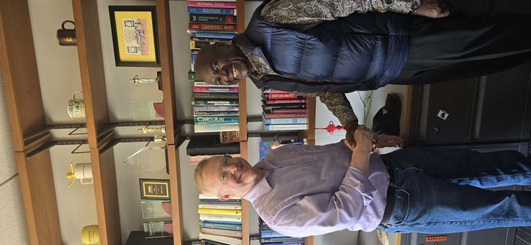 Washington Okeyo with colleague