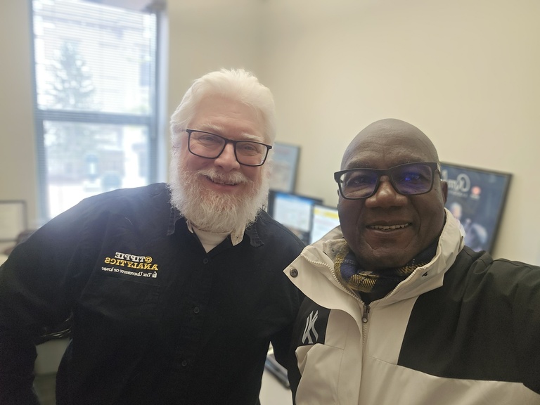 Washington Okeyo with UI colleague