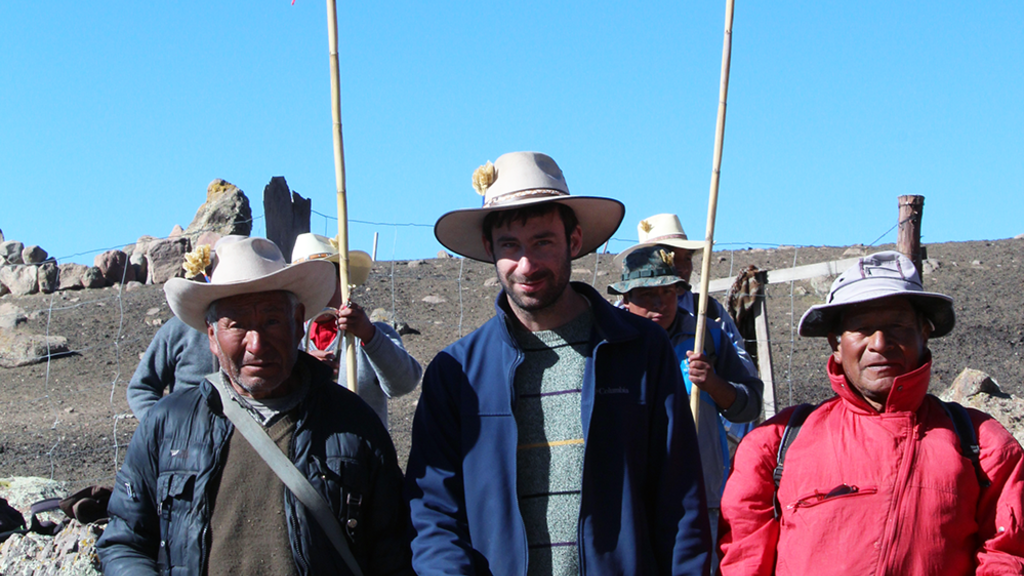 Eric Hirsch with two Peruvians, standing outdoors