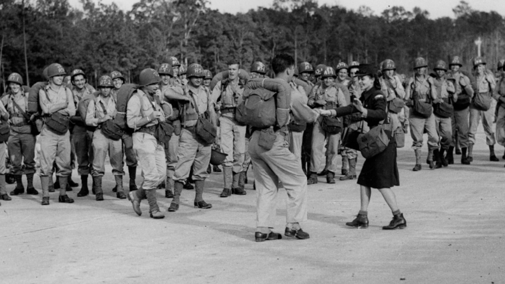 black and white photo of US soldiers swing dancing